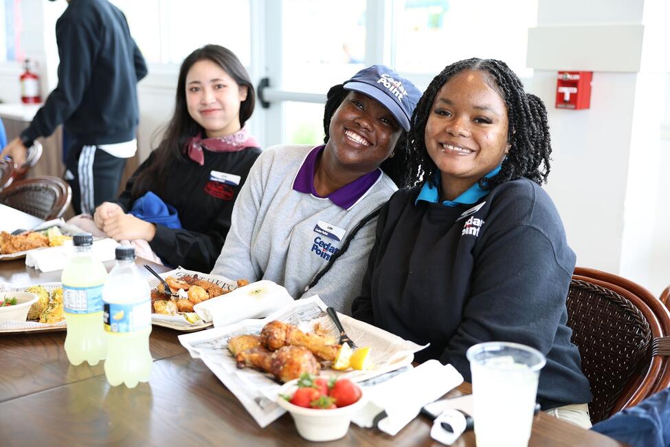 3-participants-eating-women-smiling
