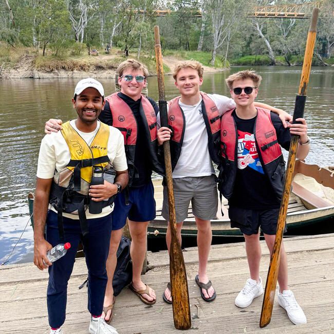 melbourne-four-male-students-life-vests-paddles-yarra-river