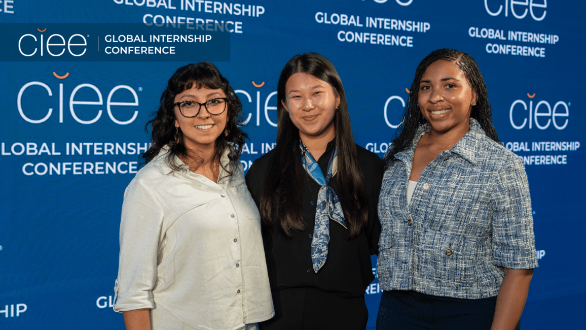 Three members of CIEE’s inaugural paid global internship cohort pose together at the 14th Annual Global Internship Conference in Tallinn, Estonia.