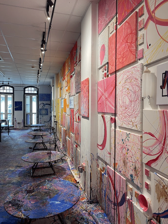 This studio is full of artwork with twelve different rotating work stations and pendulums to create various designs.