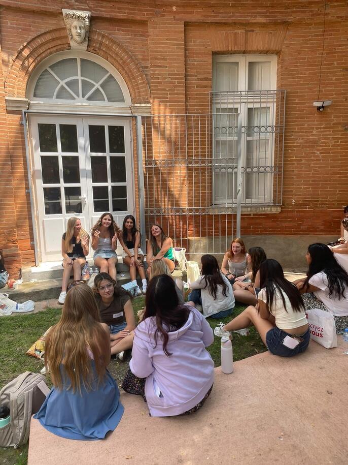 A group of students sitting and chatting