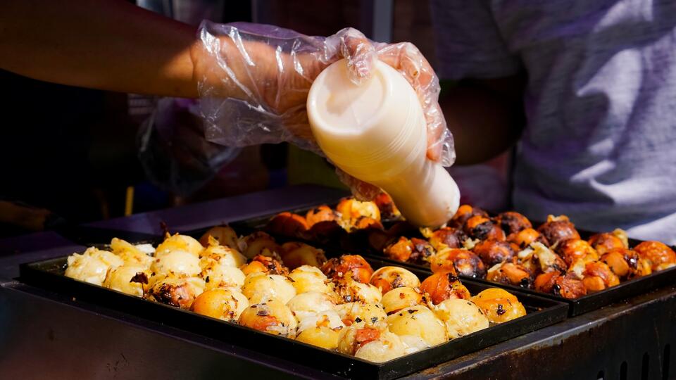 Takoyaki being made by street vendor
